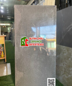 Gạch bóng 60×120 xám đen vân đá chấm trắng hạt nhỏ